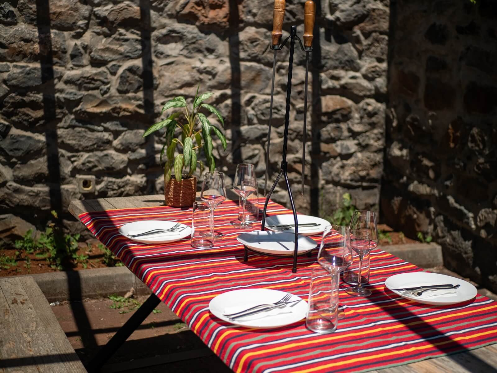Rural table set for a Madeiran cooking experience at Santo Queijo in Santo da Serra
